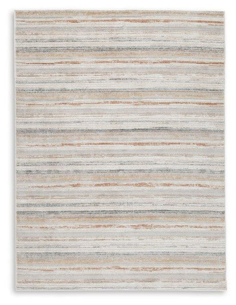 Medium Ashley Furniture Artney Rug with intricate patterns, soft texture, and neutral tones for elegant home decor.