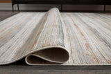 Medium Ashley Furniture Artney Rug with intricate patterns and soft textures, ideal for living room or bedroom decor.