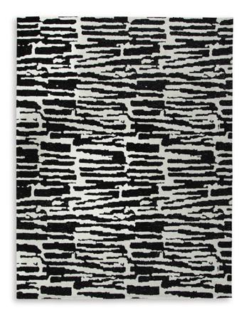 Medium Bramshaw Rug by Ashley Furniture featuring a soft, textured design in neutral tones.