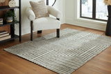 Medium Ashley Furniture Jossen Rug with intricate woven pattern, showcasing soft neutral tones and textured surface.