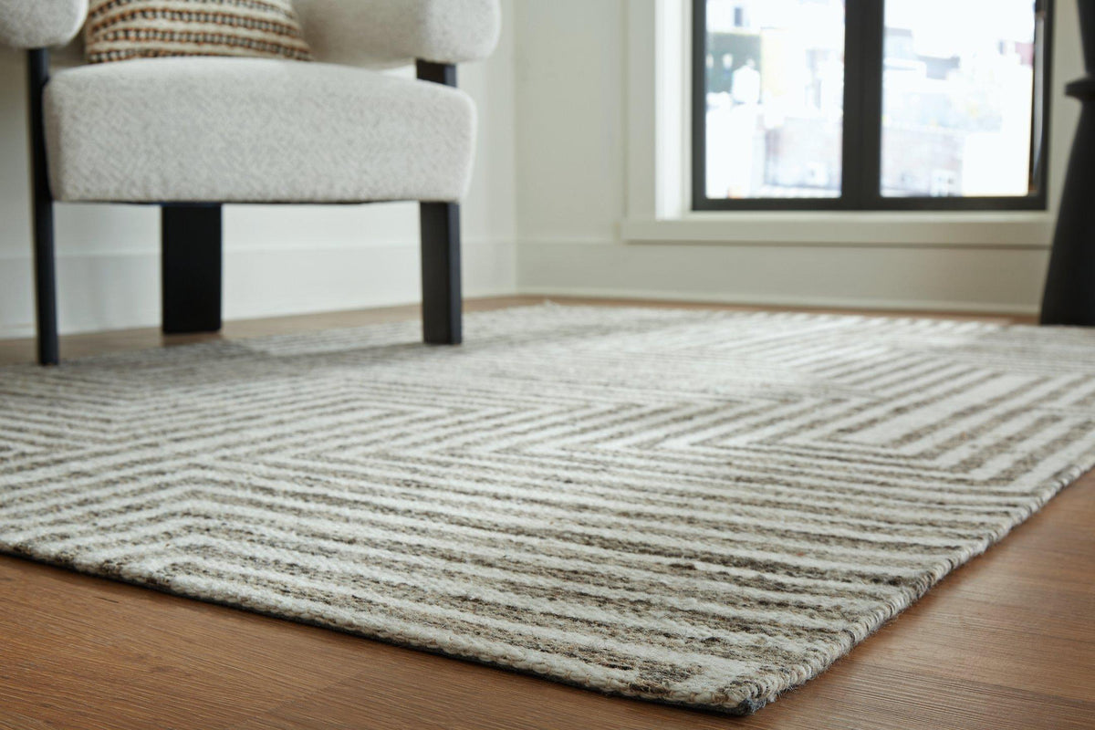 Medium Jossen Rug by Ashley Furniture featuring a soft, textured design in neutral tones for cozy living room decor.