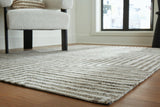 Medium Jossen Rug by Ashley Furniture featuring a soft, textured design in neutral tones for cozy living room decor.