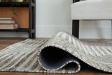 Medium Ashley Furniture Jossen Rug with intricate woven pattern and soft texture, ideal for enhancing living room decor.