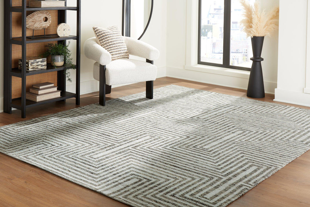 Medium Ashley Furniture Jossen Rug with intricate patterns and soft texture, ideal for living room or bedroom decor.