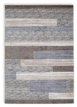 Medium Sethburn Rug by Ashley Furniture featuring a textured, woven design in warm neutral tones.