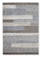 Medium Sethburn rug by Ashley Furniture featuring a soft, patterned design ideal for living room or bedroom decor.