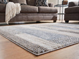 Medium Sethburn rug by Ashley Furniture featuring a soft, textured design ideal for living rooms or bedrooms.