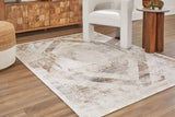 Medium Varnwood Rug by Ashley Furniture showing a textured, woven design in neutral tones on a wooden floor.