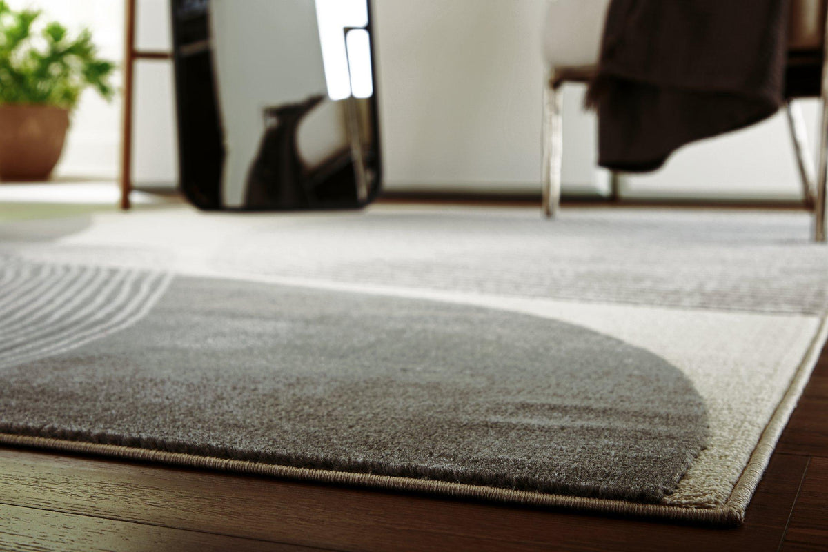 Medium Winderburg Rug by Ashley Furniture with intricate patterns and warm tones, ideal for living rooms or bedrooms.