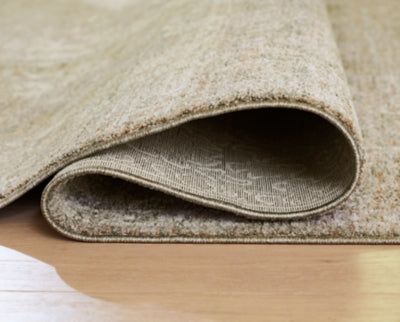 Close-up of Ashley Furniture Neroham Rug with detailed woven pattern and soft texture, showcasing its elegant design.
