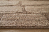 Close-up of the Ashley Furniture Orest Rug showing intricate woven pattern and soft, textured surface.