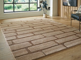 Ashley Furniture Orest Rug with intricate pattern in neutral tones, shown in a close-up, cropped view.