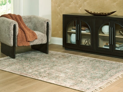 Ashley Furniture Rossbury Rug in neutral tones, cropped view showing textured woven surface and soft fabric.