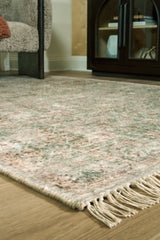 Close-up of the Ashley Furniture Rossbury Rug with intricate woven patterns and rich beige and brown tones.
