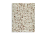 Ashley Furniture Uduak Rug with intricate woven pattern and neutral tones, perfect for living room or bedroom decor.