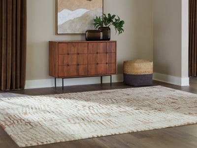 Ashley Furniture Uduak Rug featuring a textured, patterned design in neutral tones, perfect for enhancing living space decor.