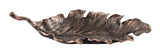Avermund sculpture by Ashley Furniture, modern metal artwork with intricate detailing, placed on a wooden surface.