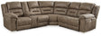 Ashley Furniture Ravenel Power Reclining Sectional shown in a modern living room with plush cushions and reclining features.