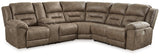 Ashley Furniture Ravenel Power Reclining Sectional shown in a modern living room with plush cushions and reclining features.