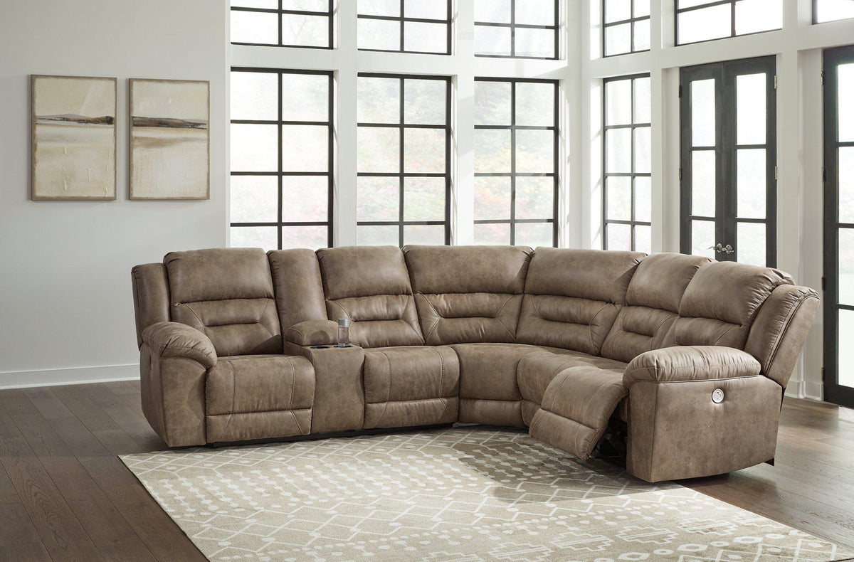 Ashley Furniture Ravenel Power Reclining Sectional with plush cushions and dark upholstery, designed for comfortable lounging.
