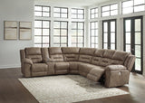Ashley Furniture Ravenel Power Reclining Sectional with plush cushions and reclining seats in a modern fabric design.