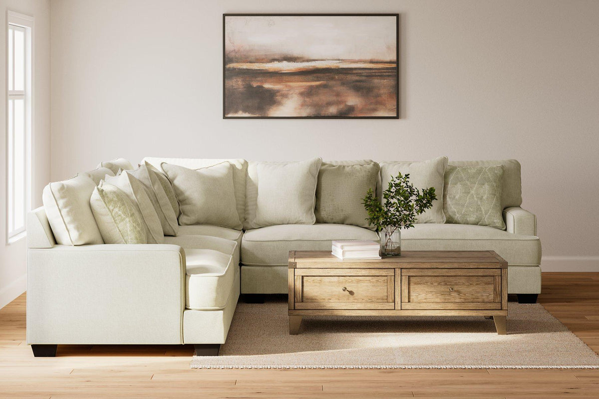 Ashley Furniture Rawcliffe sectional sofa with plush cushions and modern design, shown in a spacious living room setting.