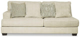 Ashley Furniture Rawcliffe sectional sofa with plush cushions and modern design, shown in a spacious living room setting.