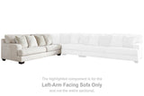 Ashley Furniture Rawcliffe sectional sofa with plush cushions and neutral fabric, shown in a modern living room setting.