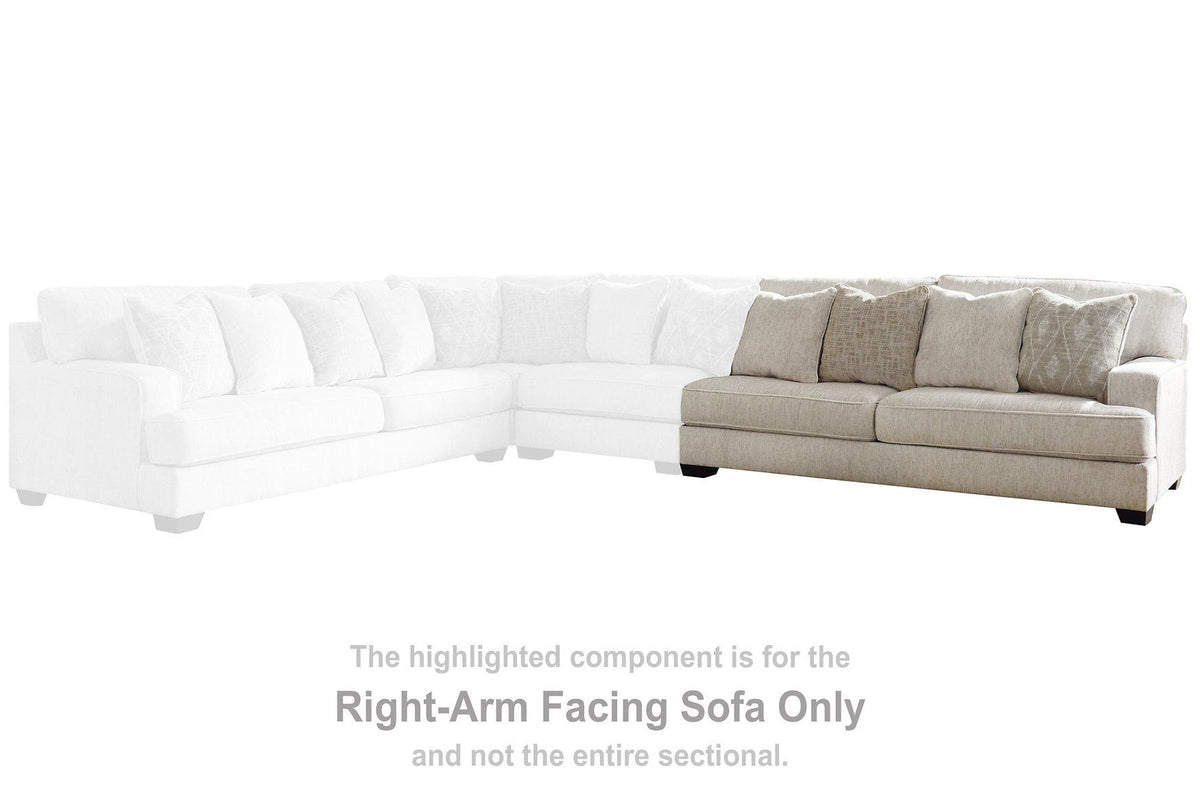 Ashley Furniture Rawcliffe sectional sofa with plush cushions and modern design, shown in a neutral fabric.