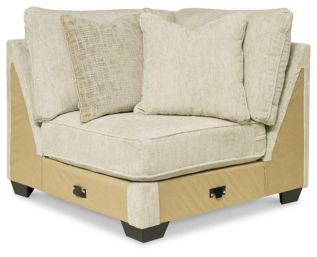 Ashley Furniture Rawcliffe sectional sofa with plush cushions and neutral fabric, perfect for contemporary living rooms.