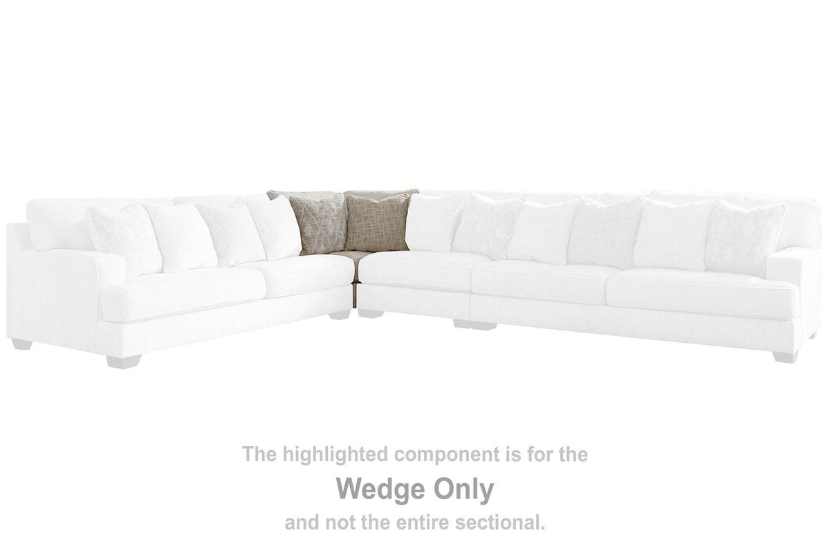 Ashley Furniture Rawcliffe sectional sofa with plush cushions and modern design, shown in a spacious living room setting.