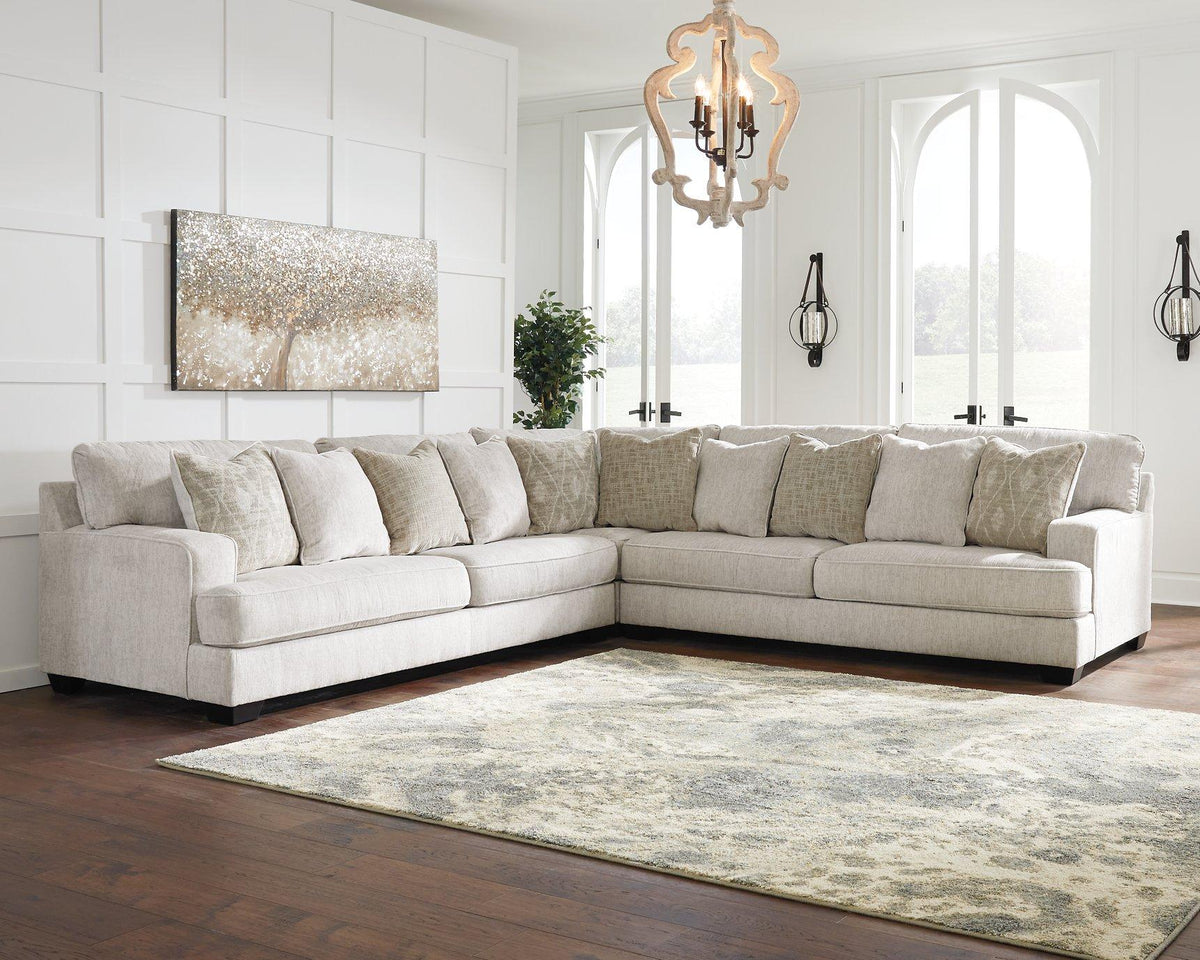 Ashley Furniture Rawcliffe sectional sofa with plush cushions and modern design, shown in a stylish living room setup.