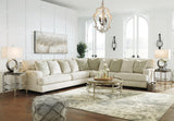 Ashley Furniture Rawcliffe sectional sofa with plush cushions and neutral upholstery, perfect for modern living rooms.