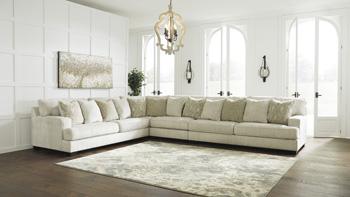 Ashley Furniture Rawcliffe sectional sofa with plush cushions and modern design, shown in a spacious living room setting.