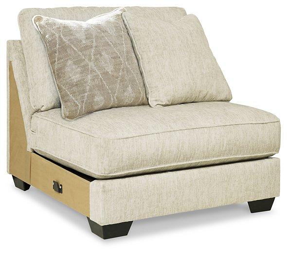 Ashley Furniture Rawcliffe sectional sofa with plush cushions and neutral fabric, shown in a spacious living room setting.