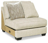 Ashley Furniture Rawcliffe sectional sofa with plush cushions and neutral fabric, shown in a spacious living room setting.