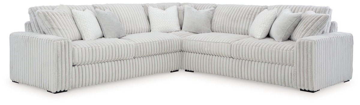 Comfortable Ashley Furniture Stupendous sectional sofa with plush cushions, modern design, and neutral fabric upholstery.