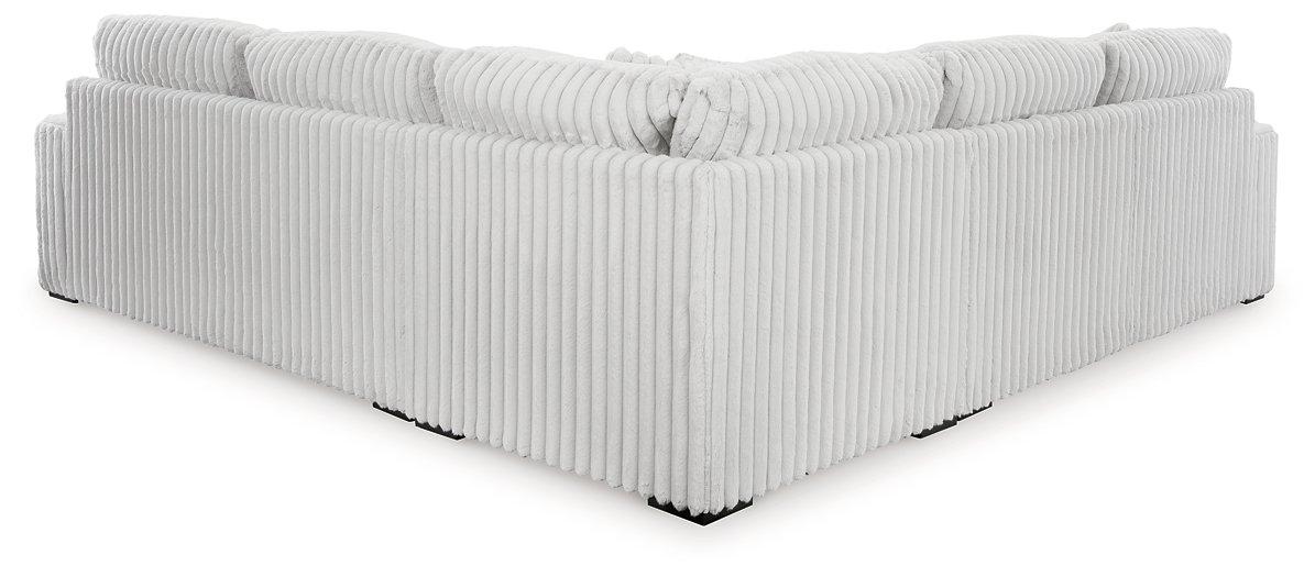 Ashley Furniture Stupendous Sectional sofa with plush cushions and modern design in a spacious living room setting.