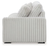 Ashley Furniture Stupendous Sectional sofa with plush cushions and wide armrests, shown in a modern living room setting.