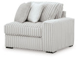 Ashley Furniture Stupendous sectional sofa shown from an angled view with plush cushions and modern design.