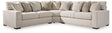 Ashley Furniture Ballyton sectional sofa with plush cushions and neutral fabric, shown in a spacious living room setting.