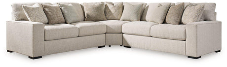 Ashley Furniture Ballyton sectional sofa with plush cushions and neutral fabric, shown in a spacious living room setting.