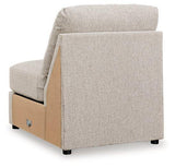 Ashley Furniture Ballyton Sectional sofa with plush cushions and neutral fabric upholstery in a modern living room setting.