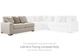 Ashley Furniture Ballyton sectional sofa with plush cushions and modern design, shown in a cozy living room setting.