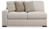 Ashley Furniture Ballyton sectional sofa with plush cushions and modern design, shown in a stylish living room setting.