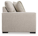 Ashley Furniture Ballyton Sectional sofa with plush cushions and neutral fabric, ideal for modern living room comfort.