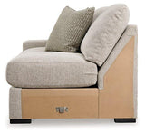 Ashley Furniture Ballyton sectional sofa with plush cushions and neutral fabric, perfect for modern living rooms.