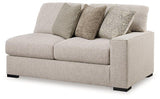 Ashley Furniture Ballyton sectional sofa with plush cushions and neutral fabric, perfect for modern living rooms.