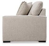 Ashley Furniture Ballyton sectional sofa with plush cushions and modern design in a spacious living room setting.