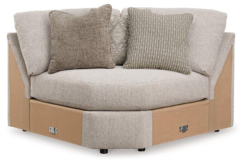 Ashley Furniture Ballyton sectional sofa with plush cushions and neutral fabric in a modern living room setting.